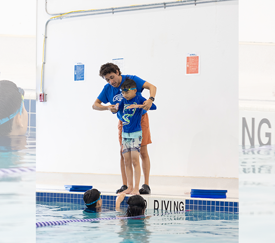 Young swimmers practicing stroke techniques during MSS Swim Team training at Marina Swim School