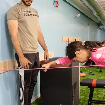 Participants engaging in dryland exercises at Marina Swim School's Dry Swim Program, focusing on strength and flexibility