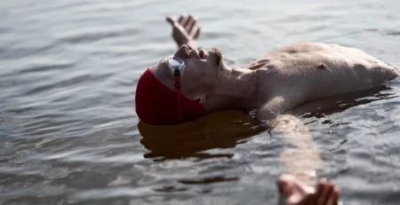 close-up-man-floating-lake